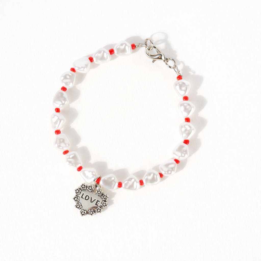 PULSERA CON PERLAS Y DIJE DE CORAZON